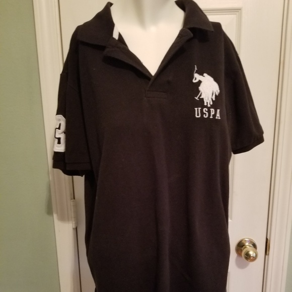 Black polo style shirt. - Picture 1 of 2